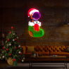 The cute Astronaut is sitting on the Christmas Sock Artwork Led Neon Sign - Reels Custom